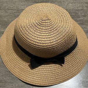 Stylish Tan Straw Hat with Black Ribbon